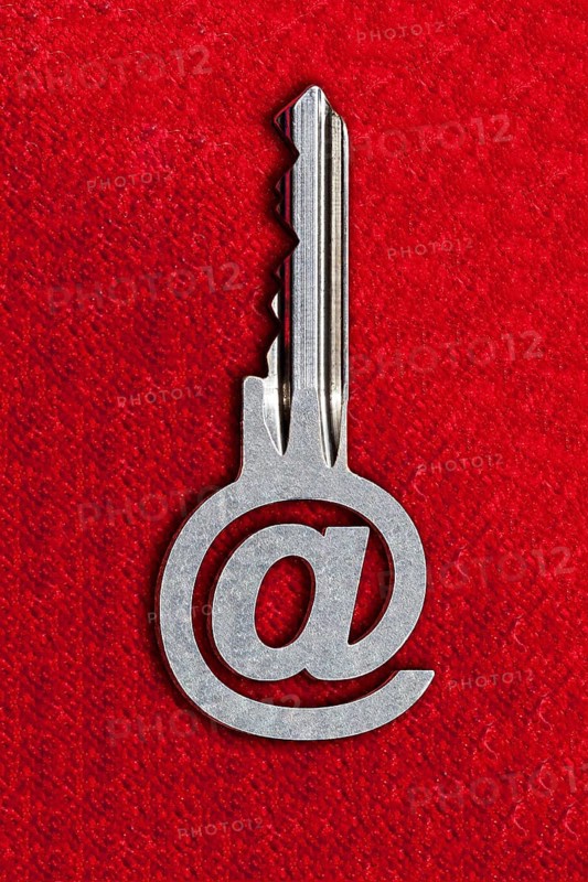 @ sign key against a red background