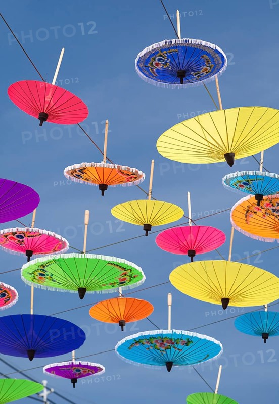 Many colourful umbrellas suspended in mid-air
