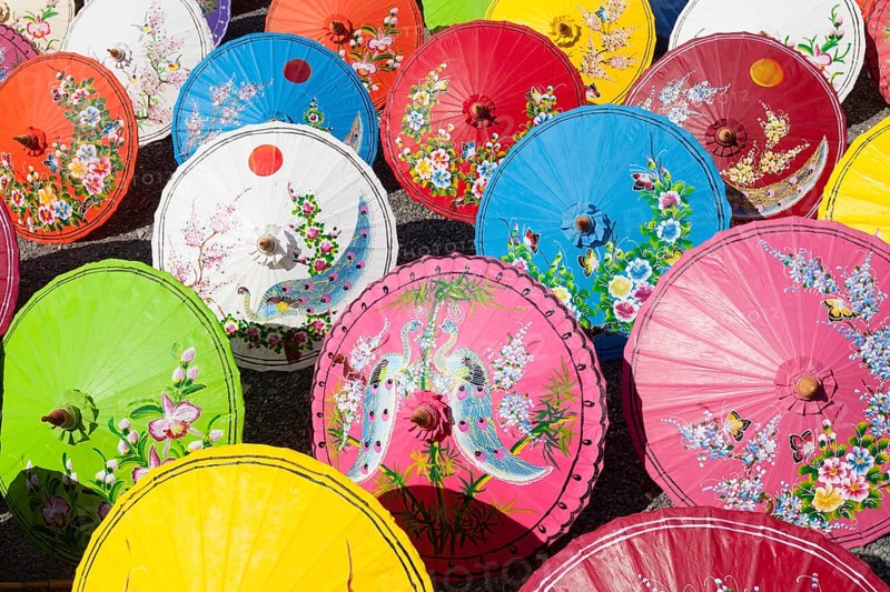 Handmade paper parasols drying in the sun at an umbrella factory in Bo Sang