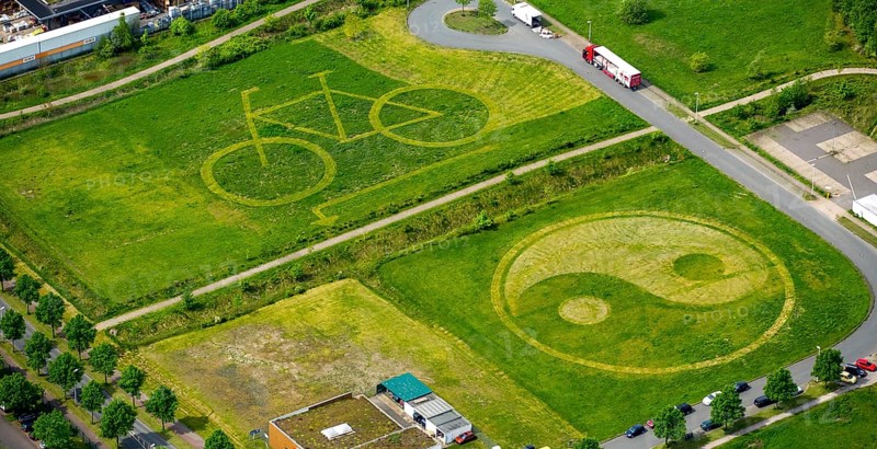 Bicycle and Yin Yang symbol mowed into a meadow