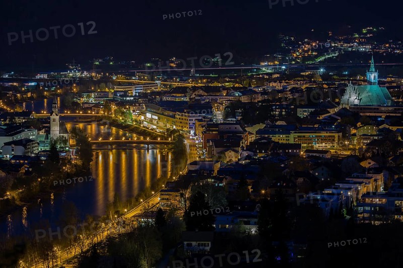 View of the town at night with Spitalkirche am Inn left and Stadtpfarrkirche right