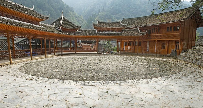 Traditional pagodas line the meeting place in the Miao village of Langde