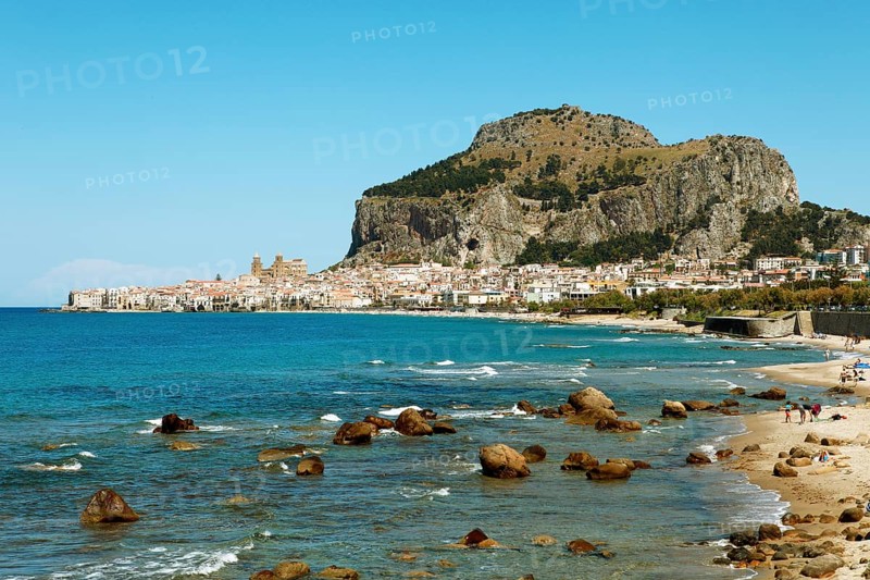Beach and limestone cliff Rocca di Cefalu