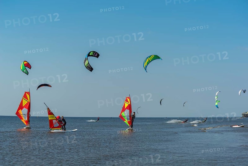 Kitesurfers and windsurfers