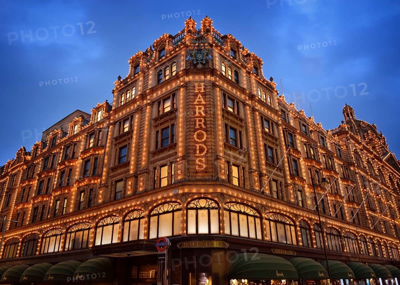 Illuminated Harrods department store in the evening