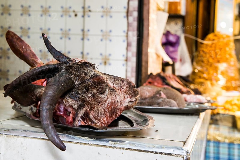 Butcher's with goat head on display