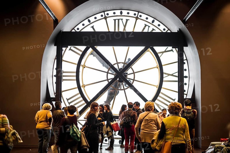 Large clock and people