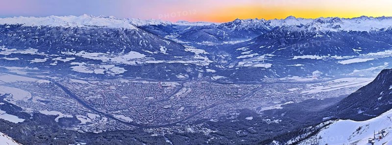 Innsbruck covered in snow at dusk