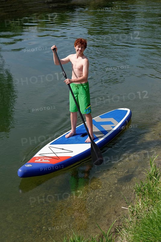 Boy on a stand up board