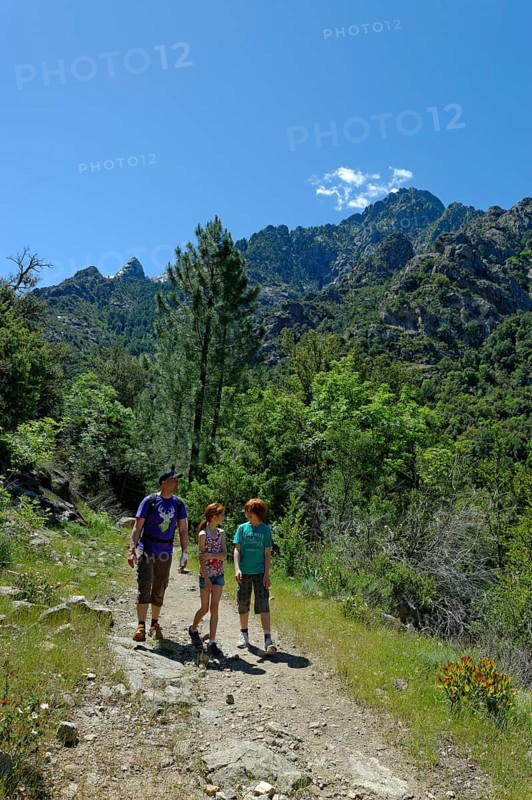 Hikers at the Cirque de Bonifatu Boucle de Ficaghiola at the long-distance trail Tra Mare e Monti and GR20