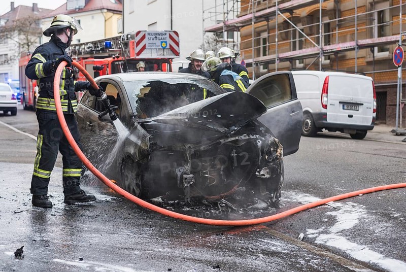 Fire department extinguishing a burning Corsa