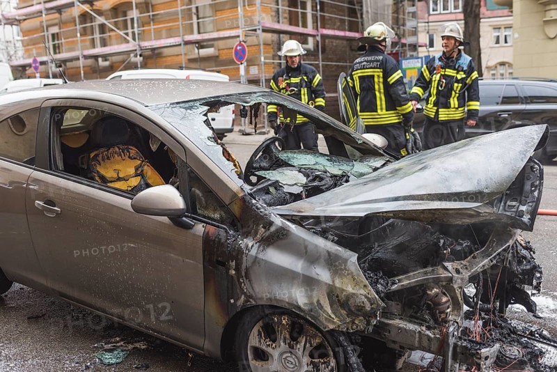 Fire department extinguishing a burning Corsa