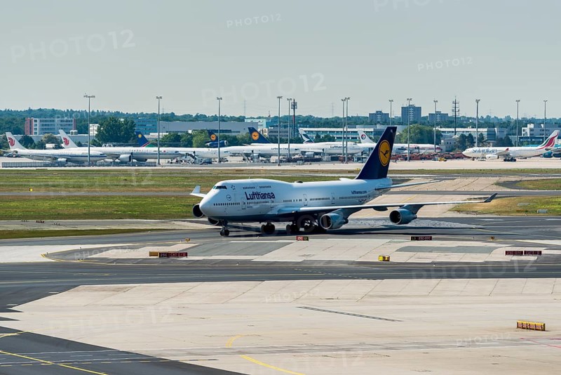 A Boeing 747 of the airline Lufthansa is moving on the ground of Frankfurt International Airport
