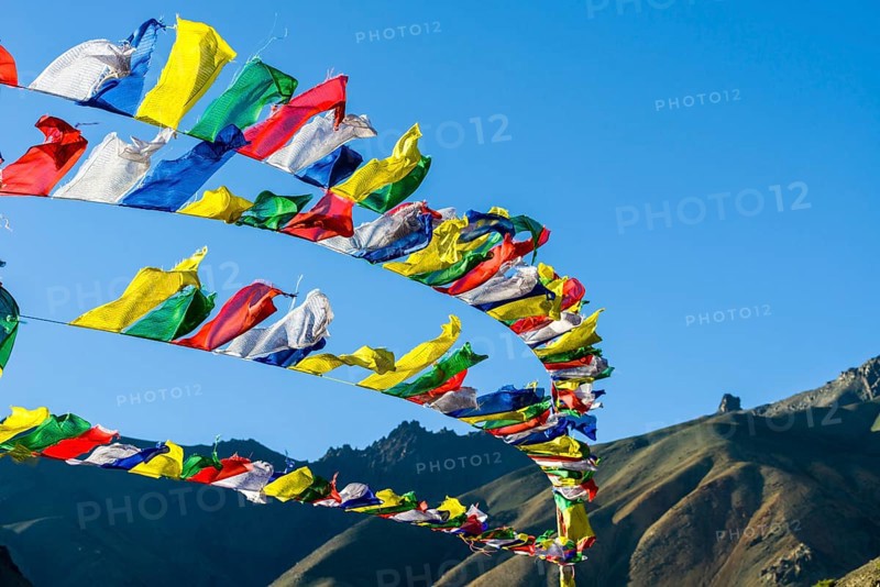 Tibetan prayer flags waving in the wind at Lamayuru Gompa