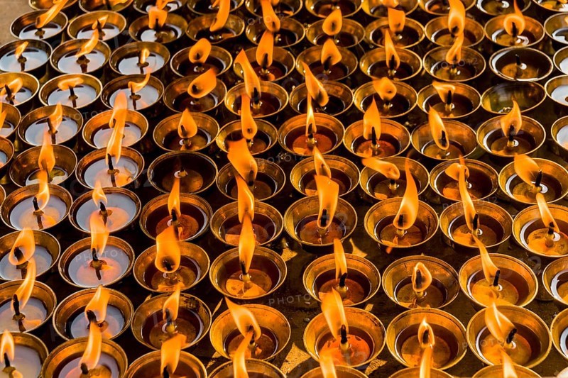 Many butter lamps are lightened at a temple in Boudha
