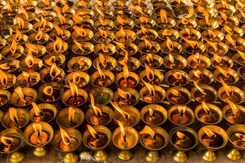 Many butter lamps are lightened at a temple in Boudha