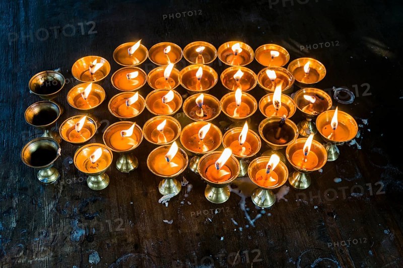 Many butter lamps are lightened at a temple in Boudha