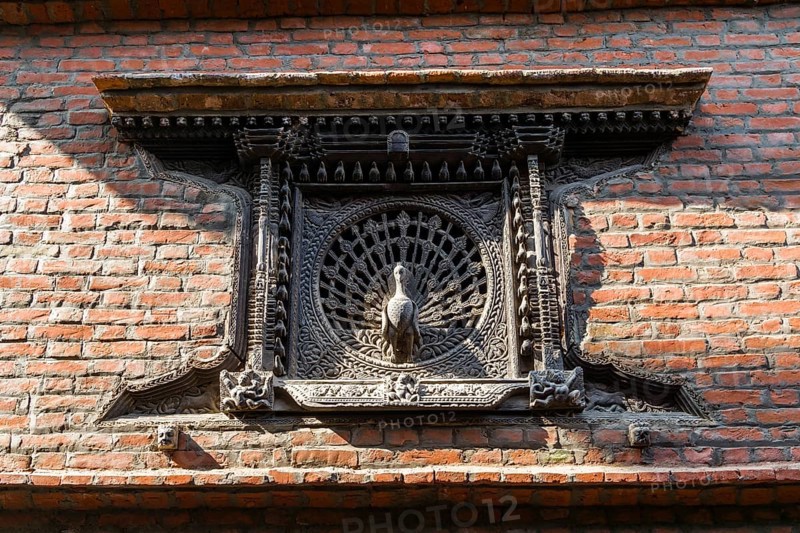 Carved wooden Peacock Window at a house