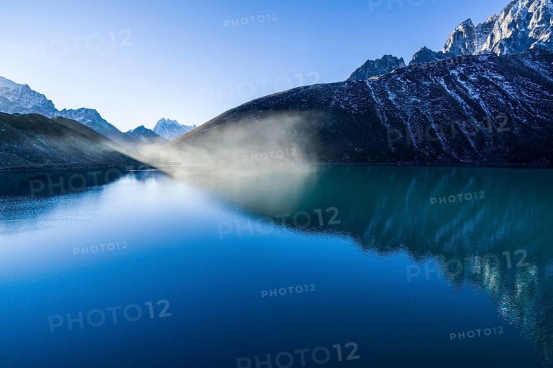 Morning mist over Gokyo Lake at sunrise
