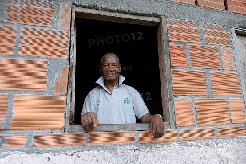 Old man looking out of window