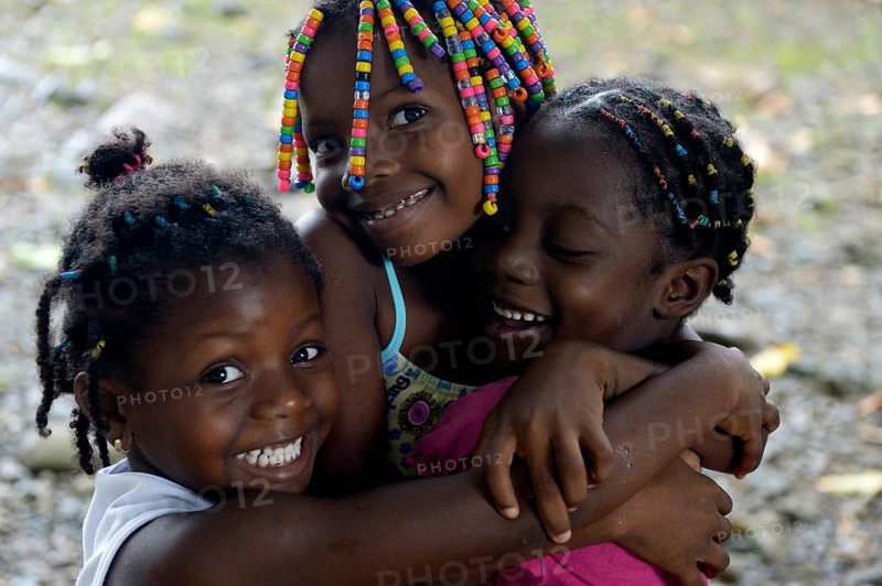 Three girls hugging each other