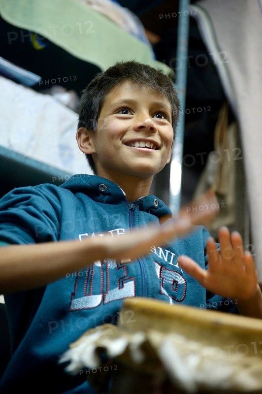 Boy cheerful drumming