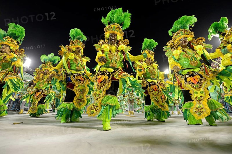 Samba dancers parade of the samba school Beija Flor de Nilopolis