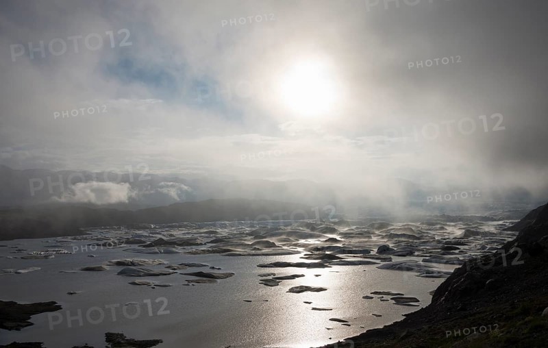 Glacial lake in fog