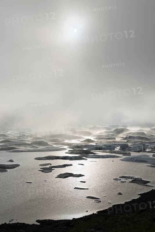 Glacial lake in fog