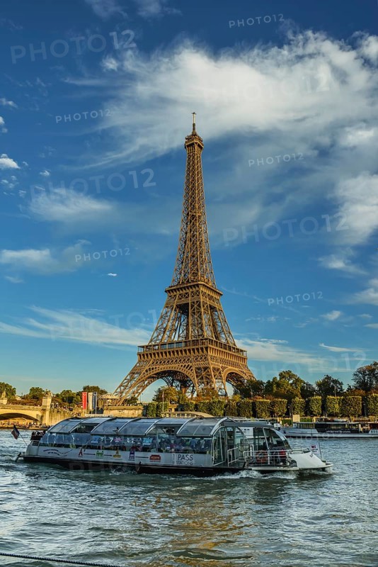 Eiffel Tower with passenger ferry Bateaux Mouches on the Seine