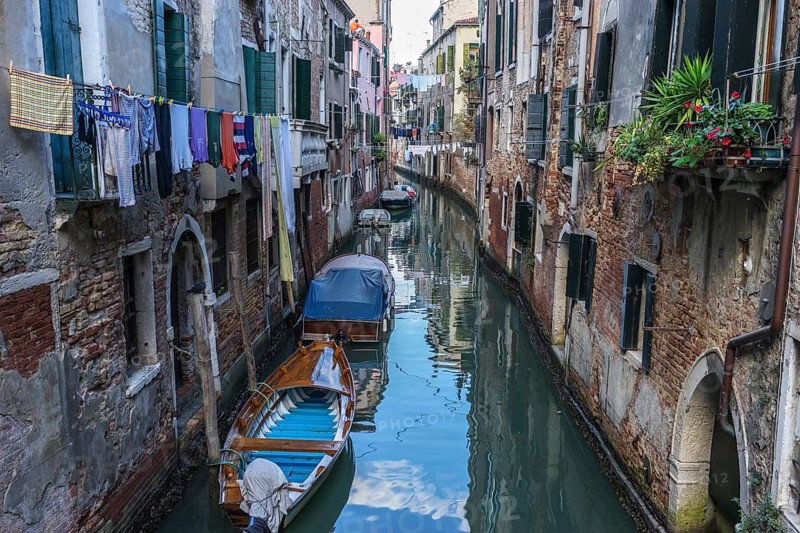 Canal with boats moored