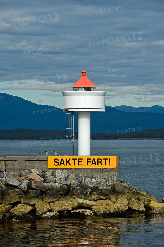 Molde lighthouse with sail slowly warning sign