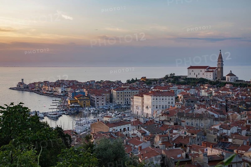Cityscape with lighthouse and Cathedral of St. George