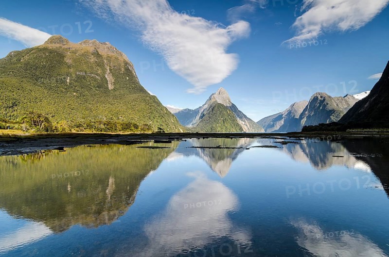 Mitre Peak with blue sky and clouds