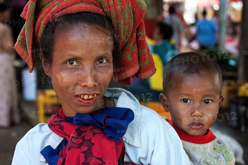 Local woman with typical headgear with child