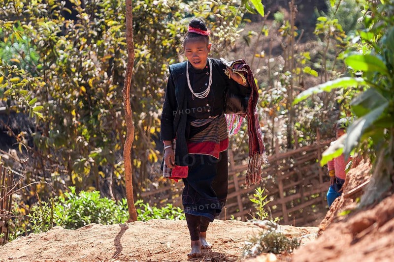 Native woman in typical clothing from the Ann tribe in a mountain village at Pin Tauk