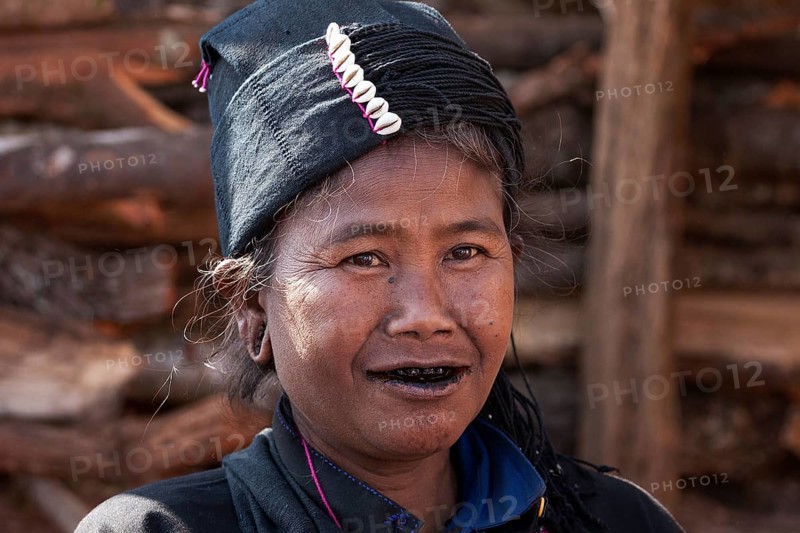 Native woman in typical clothing and headgear from the Ann tribe in a mountain village at Pin Tauk