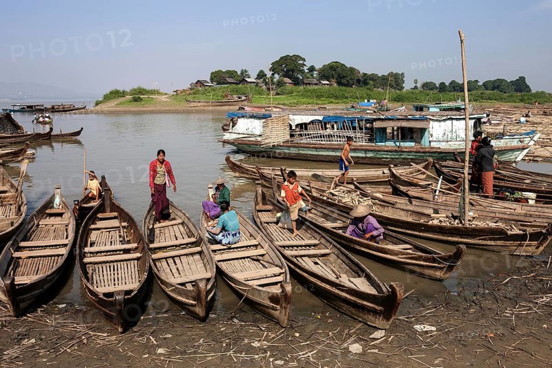 Many wooden boats at the dock in the river Irrawaddy