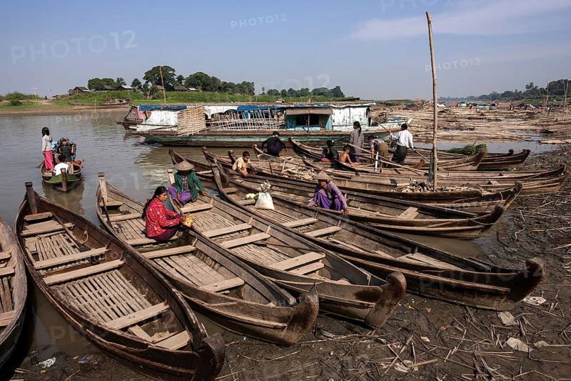 Many wooden boats at the dock in the river Irrawaddy