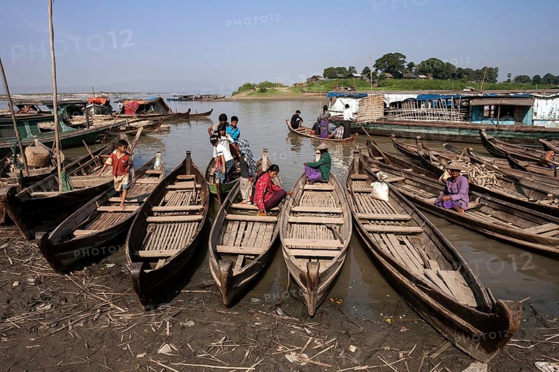 Many wooden boats at the dock in the river Irrawaddy