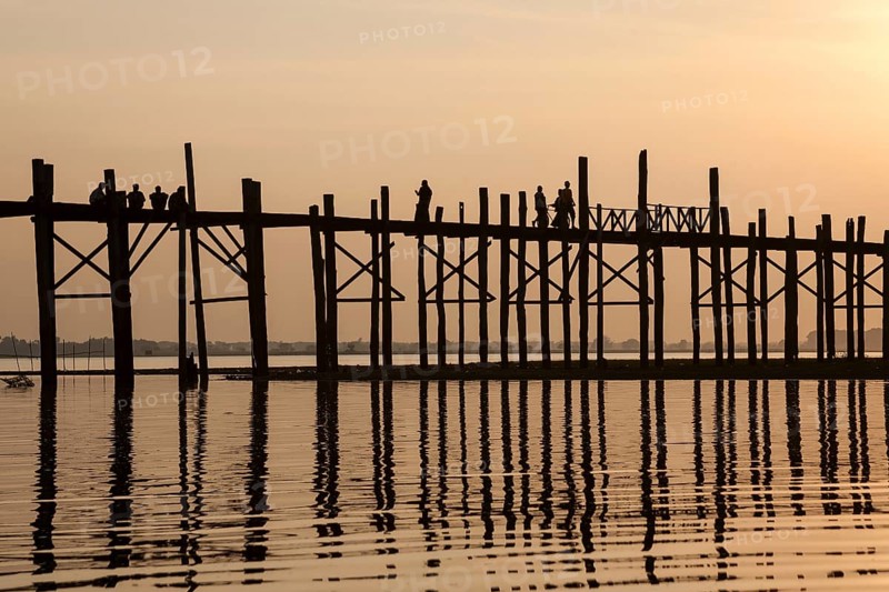 People walking on the U Bein Bridge