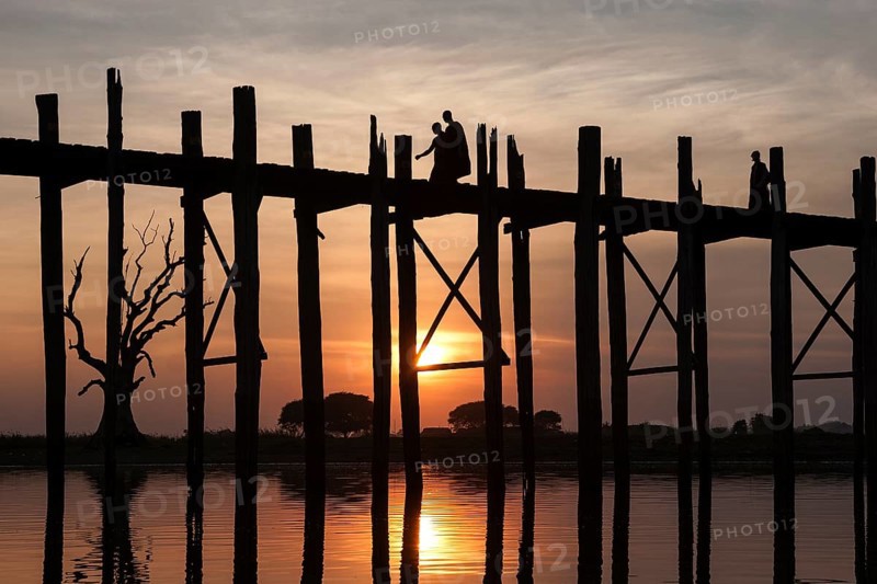 Two monks walking on the U Bein Bridge