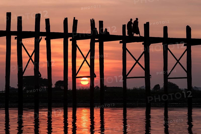 Two monks walking on the U Bein Bridge