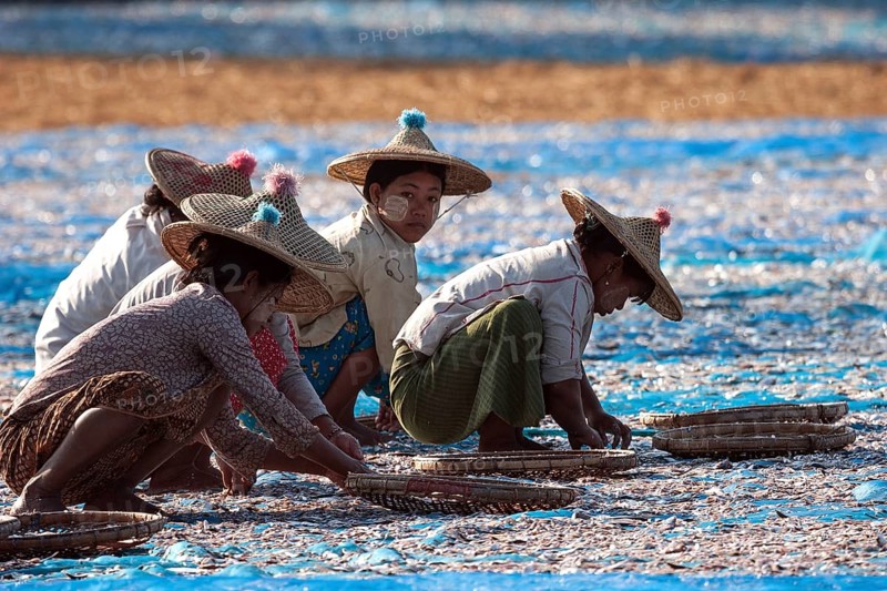 Local women wearing straw hats