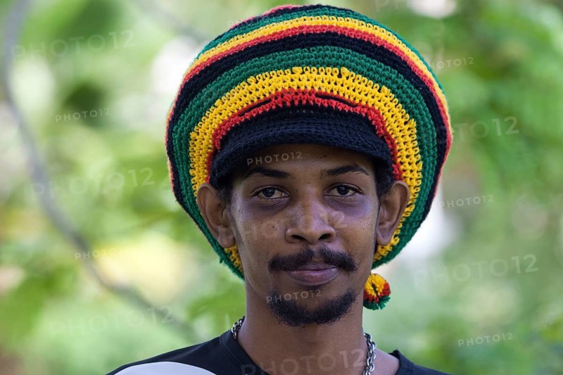Indigenous man with a colorful Rastafarian hat