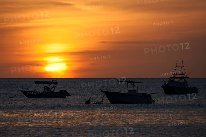 Sunset over the sea in the Beau Vallon Bay