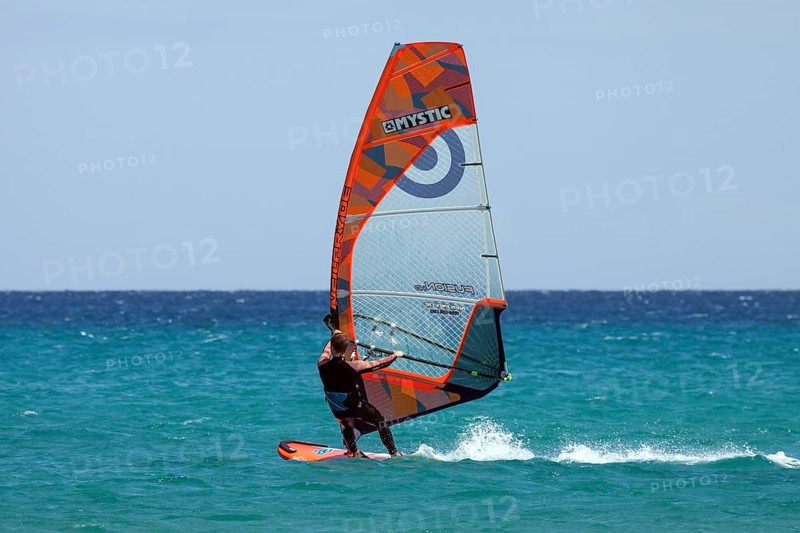 Windsurfer surfing in the sea
