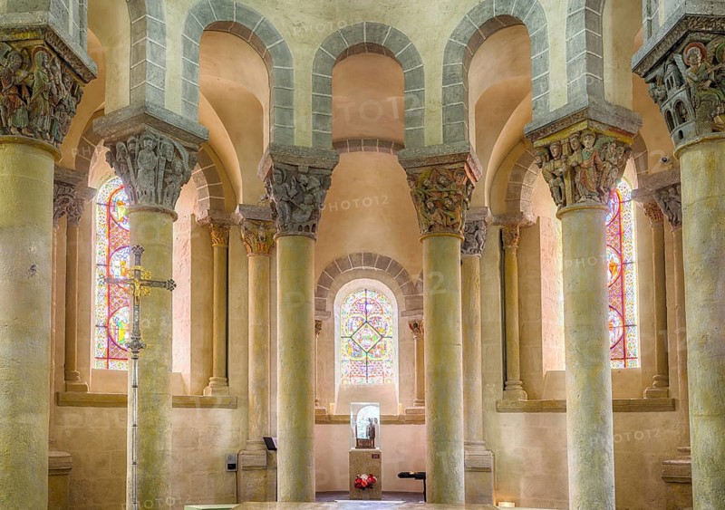 Capitals with colourful paintings, church of Saint-Nectaire