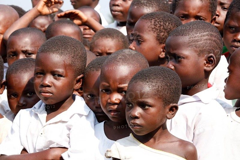 Group of students in schoolyard during morning assembly