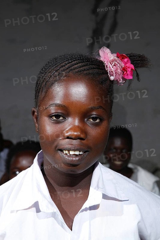 Schoolgirl in uniform with hair decoration